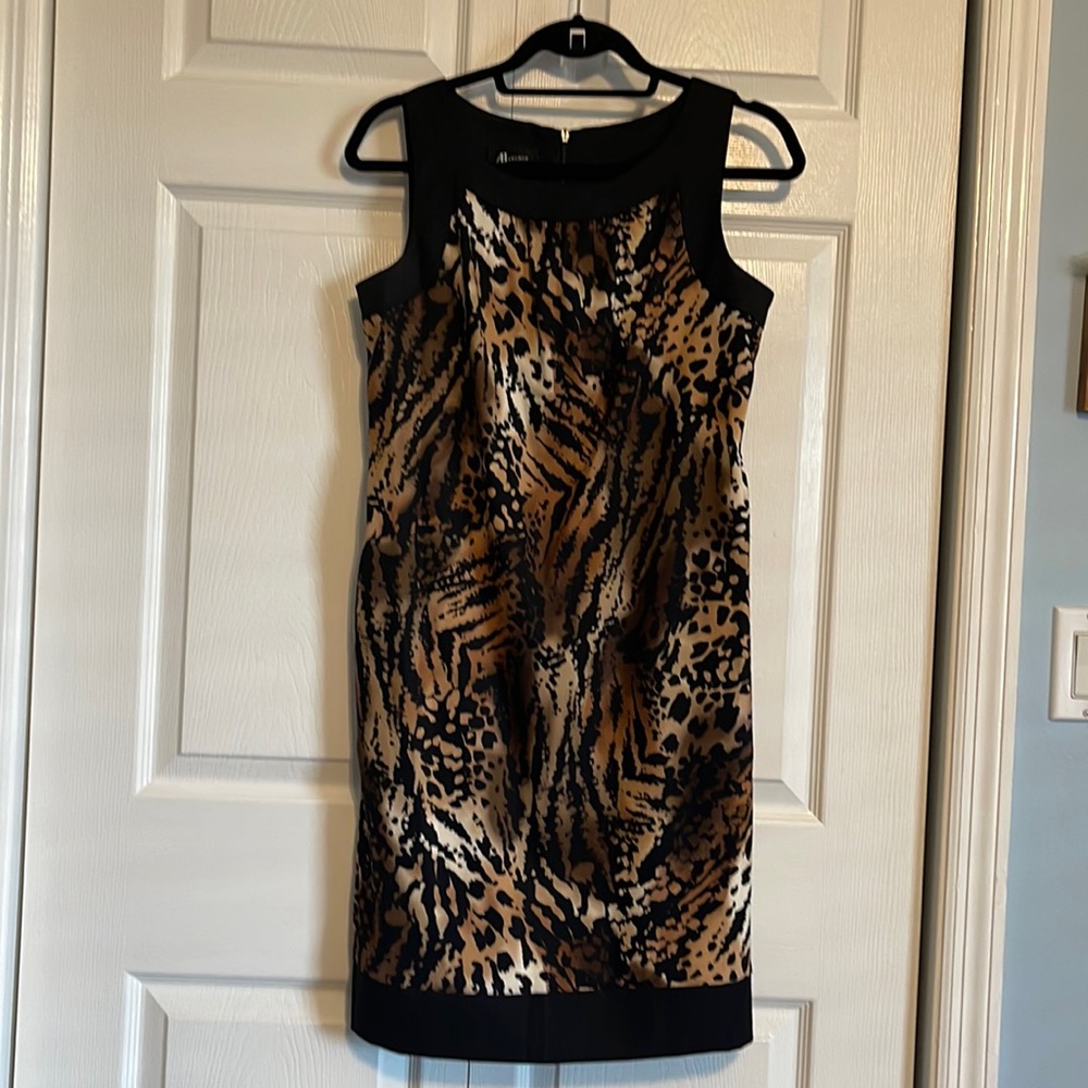 Elegant shift style knee length dress.